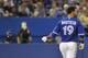 TORONTO, CANADA - JULY 3: Jose Bautista #19 of the Toronto Blue Jays tosses his helmet after striking out during MLB game action against the Kansas City Royals July 3, 2012 at Rogers Centre in Toronto, Ontario, Canada. (Photo by Brad White/Getty Images)