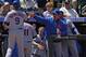 DENVER, CO - APRIL 29: Kirk Nieuwenhuis #9 of the New York Mets and Ruben Tejada #11 of the New York Mets are welcomed back to the dugout by batting coach Dave Hudgens #51 of the New York Mets after they scored on a double by David Wright #5 of the New York Mets off of starting pitcher Jamie Moyer #50 of the Colorado Rockies to give the Mets a 2-0 lead in the first inning at Coors Field on April 29, 2012 in Denver, Colorado. (Photo by Doug Pensinger/Getty Images)