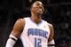 ORLANDO, FL - MARCH 13: Dwight Howard #12 of the Orlando Magic smiles during the game against the Miami Heat at Amway Center on March 13, 2012 in Orlando, Florida. NOTE TO USER: User expressly acknowledges and agrees that, by downloading and or using this photograph, User is consenting to the terms and conditions of the Getty Images License Agreement. (Photo by Sam Greenwood/Getty Images)