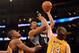 LOS ANGELES, CA - FEBRUARY 29: Anthony Randolph #15 of the Minnesota Timberwolves scores in front of Troy Murphy #14 and Andrew Bynum #17 of the Los Angeles Lakers at Staples Center on February 29, 2012 in Los Angeles, California. NOTE TO USER: User expressly acknowledges and agrees that, by downloading and or using this photograph, User is consenting to the terms and conditions of the Getty Images License Agreement. (Photo by Harry How/Getty Images)