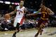 CLEVELAND, OH - DECEMBER 26: Jerryd Bayless #5 of the Toronto Raptors handles the ball against Ramon Sessions #3 of the Cleveland Cavaliers during the season opener at Quicken Loans Arena on December 26, 2011 in Cleveland, Ohio. NOTE TO USER: User expressly acknowledges and agrees that, by downloading and or using this photograph, User is consenting to the terms and conditions of the Getty Images License Agreement. (Photo by Mike Lawrie/Getty Images)