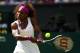 LONDON, ENGLAND - JULY 05: Serena Williams of the USA returns a shot during her Ladies' Singles semi final match against Victoria Azarenka of Belarus on day ten of the Wimbledon Lawn Tennis Championships at the All England Lawn Tennis and Croquet Club on July 5, 2012 in London, England. (Photo by Clive Brunskill/Getty Images)