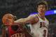 CHICAGO, IL - MAY 08: Omer Asik #3 of the Chicago Bulls knocks the ball away from Elton Brand #42 of the Philadelphia 76ers in Game Five of the Eastern Conference Quarterfinals during the 2012 NBA Playoffs at the United Center on May 8, 2012 in Chicago, Illinois. NOTE TO USER: User expressly acknowledges and agrees that, by downloading and or using this photograph, User is consenting to the terms and conditions of the Getty Images License Agreement. (Photo by Jonathan Daniel/Getty Images)