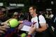 LONDON, ENGLAND - JULY 07: Andy Murray of Great Britain signs autographs for fans during a practice session on day twelve of the Wimbledon Lawn Tennis Championships at the All England Lawn Tennis and Croquet Club on July 7, 2012 in London, England. (Photo by Clive Rose/Getty Images)