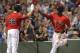 BOSTON, MA - JULY 7: Pedro Ciriaco #77 of the Boston Red Sox celebrates with Daniel Nava #66 of the Boston Red Sox after scoring a run in the seventh inning against the New York Yankees during the second game of a doubleheader at Fenway Park July 7, 2012 in Boston, Massachusetts. (Photo by Jim Rogash/Getty Images)