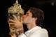 LONDON, ENGLAND - JULY 08: Roger Federer of Switzerland kisses the winner's trophy after winning his Gentlemen's Singles final match against Andy Murray of Great Britain on day thirteen of the Wimbledon Lawn Tennis Championships at the All England Lawn Tennis and Croquet Club on July 8, 2012 in London, England. (Photo by Clive Brunskill/Getty Images)