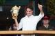 LONDON, ENGLAND - JULY 08: Roger Federer of Switzerland holds up the winner's trophy and gives a thumbs up to the crowd after winning his Gentlemen's Singles final match against Andy Murray of Great Britain on day thirteen of the Wimbledon Lawn Tennis Championships at the All England Lawn Tennis and Croquet Club on July 8, 2012 in London, England. (Photo by Clive Rose/Getty Images)