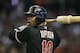PHOENIX, AZ - JULY 07: Justin Upton #10 of the Arizona Diamondbacks warms up on deck during the MLB game against the Los Angeles Dodgers at Chase Field on July 7, 2012 in Phoenix, Arizona. (Photo by Christian Petersen/Getty Images)