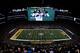 ARLINGTON, TX - FEBRUARY 06: Ben Roethlisberger #7 of the Pittsburgh Steelers is seen on the big screen as they play against the Green Bay Packers during the first quarter of Super Bowl XLV at Cowboys Stadium on February 6, 2011 in Arlington, Texas. (Photo by Tom Pennington/Getty Images)