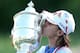 KOHLER, WI - JULY 08: Na Yeon Choi of South Korea kisses the championship trophy after her four-stroke victory of the 2012 U.S. Women's Open on July 8, 2012 at Blackwolf Run in Kohler, Wisconsin. (Photo by Elsa/Getty Images)