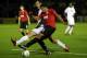ALDERSHOT, ENGLAND - OCTOBER 25: Ezekiel Fryers of Manchester United tries to tackle Danny Hylton of Aldershot during the Carling Cup Fourth Round match between Aldershot Town and Manchester United at at the EBB Stadium, Recreation Ground on October 25, 2011 in Aldershot, England. (Photo by Ian Walton/Getty Images)