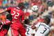 BRIDGEVIEW, IL - JULY 08: Austin Berry #22 of the Chicago Fire heads the ball over Todd Dunivant #2 and David Junior Lopes #3 of the Los Angeles Galaxy during an MLS match at Toyota Park on July 8, 2012 in Bridgeview, Illinois. The Galaxy defeated the Fire 2-0. (Photo by Jonathan Daniel/Getty Images)