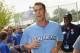 Matt Cassel makes his way through a crowd at Kauffman Stadium.