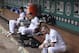SEATTLE, WA - JULY 01: (L - R) Justin Smoak #17, Jesus Montero #63, and Brendan Ryan #26 of the Seattle Mariners remain seated on the dugout bench after losing 2-1 in ten innings to the Boston Red Sox at Safeco Field on July 1, 2012 in Seattle, Washington. (Photo by Otto Greule Jr/Getty Images)