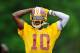 ASHBURN, VA - MAY 06: Robert Griffin III #10 of the Washington Redskins practices during the Washington Redskins rookie minicamp on May 6, 2012 in Ashburn, Virginia. (Photo by Patrick McDermott/Getty Images)