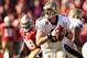 SAN FRANCISCO, CA - JANUARY 14: Drew Brees #9 of the New Orleans Saints looks to pass from the pocket against the San Francisco 49ers in the second quarter of the NFC Divisional playoff game at Candlestick Park on January 14, 2012 in San Francisco, California. (Photo by Ezra Shaw/Getty Images)