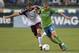 SEATTLE, WA - JULY 07: Osvaldo Alonso #6 of the Seattle Sounders dribbles against Brian Mullan #11 of the Colorado Rapids at CenturyLink Field on July 7, 2012 in Seattle, Washington. (Photo by Otto Greule Jr/Getty Images)