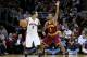 CLEVELAND, OH - DECEMBER 26: Jerryd Bayless #5 of the Toronto Raptors handles the ball against Ramon Sessions #3 of the Cleveland Cavaliers during the season opener at Quicken Loans Arena on December 26, 2011 in Cleveland, Ohio. NOTE TO USER: User expressly acknowledges and agrees that, by downloading and or using this photograph, User is consenting to the terms and conditions of the Getty Images License Agreement. (Photo by Mike Lawrie/Getty Images)
