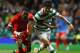 GLASGOW, SCOTLAND - AUGUST 18: Ki Sung Yeung of Celtic is tackled by Geoffray Serey Die of FC Sion during the UEFA Europa League qualifying round, first leg match between Celtic and FC Sion at Celtic Park on August 18, 2011 in Glasgow, Scotland. (Photo by Jeff J Mitchell/Getty Images)
