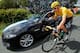 MACON, FRANCE - JULY 11: Bradley Wiggins of Great Britain riding for Sky Procycling in the race leader's yellow jersey stops by the team car for a chat with director Sean Yates during stage ten of the 2012 Tour de France from Macon to Bellegarde-Sur-Valserine on July 11, 2012 in Macon, France. (Photo by Doug Pensinger/Getty Images)