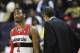 WASHINGTON, DC - FEBRUARY 29: John Wall #2 of the Washington Wizards looks up at the video board while standing next to head coach Randy Wittman during the second half against the Orlando Magic at the Verizon Center on February 29, 2012 in Washington, DC. NOTE TO USER: User expressly acknowledges and agrees that, by downloading and or using this photograph, User is consenting to the terms and conditions of the Getty Images License Agreement. (Photo by Rob Carr/Getty Images)