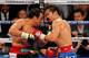 LAS VEGAS, NV - NOVEMBER 12: Juan Manuel Marquez (L) and Manny Pacquiao battle in the 10th round of their WBO world welterweight title fight at the MGM Grand Garden Arena November 12, 2011 in Las Vegas, Nevada. Pacquiao retained his title with a majority decision victory. (Photo by Ethan Miller/Getty Images)