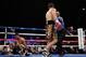 LAS VEGAS, NV - JULY 14: Danny Garcia (R) walks back to his corner after knocking down Amir Khan of Great Britain during their WBC/ WBA Super Lightweight and vacant Ring Magazine Junior Welterweight title fight at Mandalay Bay Events Center on July 14, 2012 in Las Vegas, Nevada. (Photo by Jeff Gross/Getty Images)