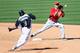 PEORIA, AZ - MARCH 06: Infielder Paul Janish #7 (R) of the Cincinnati Reds gets the force out on Chone Figgins #9 of the Seattle Mariners during the spring training game at Peoria Stadium on March 6, 2012 in Peoria, Arizona. (Photo by Christian Petersen/Getty Images)