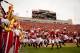 Nebraska enters the stadium to thunderous cheers and applause from their denziens of fans.