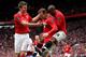 MANCHESTER, ENGLAND - APRIL 15: Wayne Rooney of Manchester United celebrates scoring the opening goal with team mates Michael Carrick (L) and Ashley Young (R) during the Barclays Premier League match between Manchester United and Aston Villa at Old Trafford on April 15, 2012 in Manchester, England. (Photo by Alex Livesey/Getty Images)