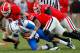 ATHENS, GA - NOVEMBER 19: Alec Ogletree #9, Jarvis Jones #29 and Cornelius Washington #83 of the Georgia Bulldogs tackle Maxwell Smith #11 of the Kentucky Wildcats at Sanford Stadium on November 19, 2011 in Athens, Georgia. (Photo by Kevin C. Cox/Getty Images)