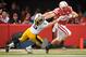 LINCOLN, NE - NOVEMBER 25: Running back Rex Burkhead #22 of the Nebraska Cornhuskers stiff-arms defensive back Tanner Miller #5 of the Iowa Hawkeyes during their game at Memorial Stadium November 25, 2011 in Lincoln, Nebraska. (Photo by Eric Francis/Getty Images)