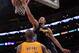 LOS ANGELES, CA - MAY 08: JaVale McGee #34 of the Denver Nuggets dunks the ball as Kobe Bryant #24 of the Los Angeles Lakers looks on in the second half in Game Five of the Western Conference Quarterfinals in the 2012 NBA Playoffs on May 8, 2012 at Staples Center in Los Angeles, California. NOTE TO USER: User expressly acknowledges and agrees that, by downloading and or using this photograph, User is consenting to the terms and conditions of the Getty Images License Agreement. (Photo by Jeff Gross/Getty Images)