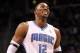 ORLANDO, FL - MARCH 13: Dwight Howard #12 of the Orlando Magic smiles during the game against the Miami Heat at Amway Center on March 13, 2012 in Orlando, Florida. NOTE TO USER: User expressly acknowledges and agrees that, by downloading and or using this photograph, User is consenting to the terms and conditions of the Getty Images License Agreement. (Photo by Sam Greenwood/Getty Images)