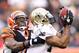 CINCINNATI, OH - DECEMBER 05: Robert Meachem #17 of the New Orleans Saints catches pass while defended by Chinedum Ndukwe #41 of the Cincinnati Bengals during the NFL game at Paul Brown Stadium on December 5, 2010 in Cincinnati, Ohio. The Saints won 34-30. (Photo by Andy Lyons/Getty Images)