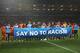 JOHANNESBURG, SOUTH AFRICA - JULY 02: Players stand behind a 'Say No To Racism' banner prior to the 2010 FIFA World Cup South Africa Quarter Final match between Uruguay and Ghana at the Soccer City stadium on July 2, 2010 in Johannesburg, South Africa. (Photo by Michael Steele/Getty Images)