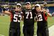 DETROIT, MI - DECEMBER 02: Pat Schiller #53, Scott Wedige #71 and Chandler Harnish #12 of the Northern Illinois Huskies pose for a photo after winning the MAC Championship game against the Ohio Bobcats at Ford Field on December 2, 2011 in Detroit, Michigan. The Huskies defeated the Bobcats 23-20. (Photo by Mark A. Cunningham/Getty Images)