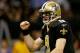 NEW ORLEANS, LA - JANUARY 07: Drew Brees #9 of the New Orleans Saints celebrates after a touchdown in the second quarter against the Detroit Lions during their 2012 NFC Wild Card Playoff game at Mercedes-Benz Superdome on January 7, 2012 in New Orleans, Louisiana. (Photo by Chris Graythen/Getty Images)