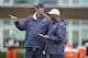 LAKE FOREST, IL - MAY 12: Offensive coordinator Mike Tice (L) and head coach Lovie Smith of the Chicago Bears stand on the field during rookie minicamp at Halas Hall on May 12, 2012 in Chicago, Illinois. (Photo by Brian Kersey/Getty Images)