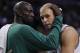 April 1, 2012; Boston, MA, USA; Boston Celtics forward/center Kevin Garnett (left) welcomes center Greg Stiemsma (right) back to the bench during the fourth quarter against the Miami Heat at TD Banknorth Garden. Boston won 91-72. Mandatory Credit: Greg M. Cooper-US PRESSWIRE