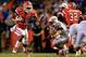 GAINESVILLE, FL - SEPTEMBER 03: Mike Gillislee #23 of the University of Florida Gators attempts to run past Marcus Bartels # 27 of the Florida Atlantic University Owls during a game at Ben Hill Griffin Stadium on September 3, 2011 in Gainesville, Florida. (Photo by Sam Greenwood/Getty Images)