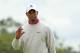 LYTHAM ST ANNES, ENGLAND - JULY 19: Tiger Woods of the United States acknowledges the crowd on the twelveth green during the first round of the 141st Open Championship at Royal Lytham & St Annes Golf Club on July 19, 2012 in Lytham St Annes, England. (Photo by Andrew Redington/Getty Images)