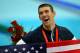 BEIJING - AUGUST 17: Michael Phelps of the United States smiles with the American flag as he wears his eighth gold medal after the Men's 4x100 Medley Relay at the National Aquatics Centre during Day 9 of the Beijing 2008 Olympic Games on August 17, 2008 in Beijing, China. (Photo by Adam Pretty/Getty Images)