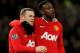 MANCHESTER, ENGLAND - DECEMBER 10: (L-R) Wayne Rooney of Manchester United is congratulated by teammate Danny Welbeck after scoring his team's second goal during the Barclays Premier League match between Manchester United and Wolverhampton Wanderers at Old Trafford on December 10, 2011 in Manchester, England. (Photo by Alex Livesey/Getty Images)