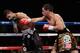 Danny Garcia punishing Amir Khan against the ropes