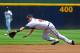ATLANTA, GA - JULY 19: Paul Janish #4 of the Atlanta Braves dives for a ground ball against the San Francisco Giants at Turner Field on July 19, 2012 in Atlanta, Georgia. (Photo by Scott Cunningham/Getty Images)