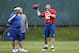INDIANAPOLIS, IN - MAY 4: Andrew Luck #12 of the Indianapolis Colts works out as quarterbacks coach Clyde Christensen looks on during a rookie minicamp at the team facility on May 4, 2012 in Indianapolis, Indiana. (Photo by Joe Robbins/Getty Images)