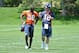 June 4, 2012; Englewood, CO, USA; Denver Broncos quarterback Peyton Manning (18) speaks to wide receiver Demaryius Thomas (88) following organized team activities at the Broncos training facility. Mandatory Credit: Ron Chenoy-US PRESSWIRE
