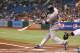 July 3, 2012; St. Petersburg, FL, USA; New York Yankees second baseman Robinson Cano (24) hit an RBI single in the first inning against the Tampa Bay Rays at Tropicana Field. Mandatory Credit: Kim Klement-US PRESSWIRE