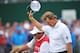 LYTHAM ST ANNES, ENGLAND - JULY 22: Ernie Els of South Africa walks with his caddie Ricci Roberts to the 18th green during the final round of the 141st Open Championship at Royal Lytham & St. Annes Golf Club on July 22, 2012 in Lytham St Annes, England. (Photo by Stuart Franklin/Getty Images)